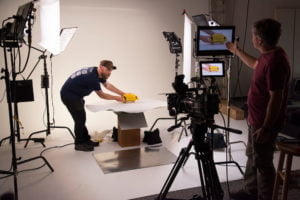 two video production team members working on a promotional video